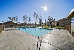 Lancaster apartment for rent - A sunny day at a pool with a clear blue sky.