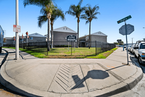 San Bernardino apartment for rent - A street corner with a "No Parking" sign and a building in the background.