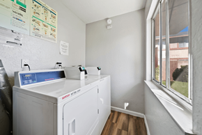 Redlands apartment for rent - A small laundry room with a washer and dryer.
