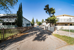 Ontario apartment for rent - A residential street with houses on both sides and trees lining the street.