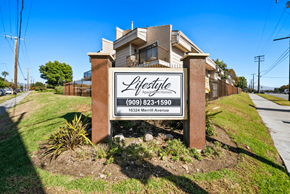 Fontana apartment for rent - A sign for Lifestyle Apartments with a phone number and address.