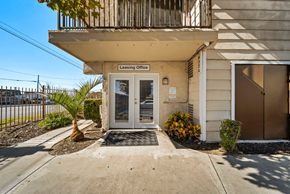 Fontana apartment for rent - The image shows the front of a building with a leasing office sign on it.