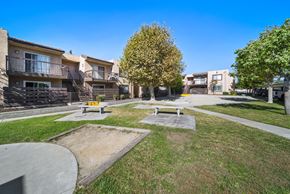 Fontana apartment for rent - A sunny day at a park with benches and trees.