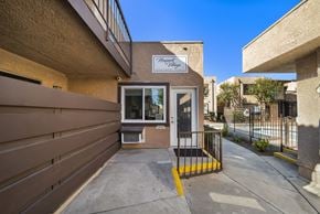 Fontana apartment for rent - The entrance to a building with a sign that reads "Harvest House.".