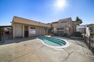Fontana apartment for rent - A sunny day at the pool area of a residential complex.