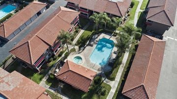 Fontana apartment for rent - A swimming pool is surrounded by a red tiled roof.