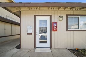Fontana apartment for rent - A white door with a glass window and a sign on it.