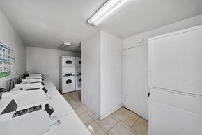 Fontana apartment for rent - A room with white walls and a white floor with boxes on the table.