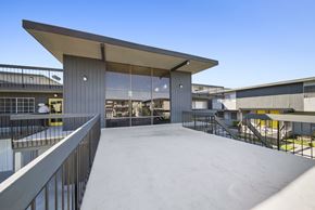Rowland Heights apartment for rent - A modern building with a large open space and a metal railing.