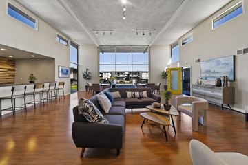 Rowland Heights apartment for rent - A modern living room with a large couch and a coffee table.