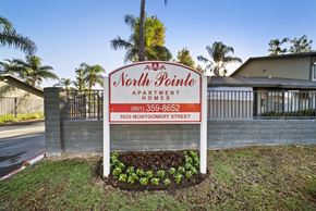 Riverside apartment for rent - A sign for North Pointe Apartments is displayed in front of a building.