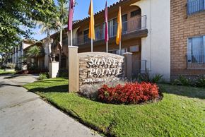 Van Nuys apartment for rent - The sign in front of the building says Sunset Pointe Apartment Homes.