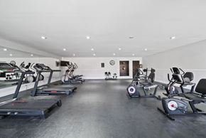 Van Nuys apartment for rent - A gym with treadmills, exercise bikes, and other equipment.