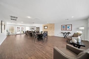 Las Vegas apartment for rent - A spacious living room with a dining table and chairs.