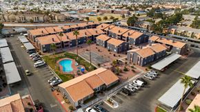 Las Vegas apartment for rent - A large building complex with a pool in the middle.