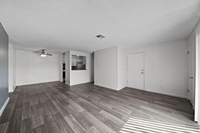 Las Vegas apartment for rent - A room with a ceiling fan and a door.