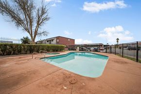 Las Vegas apartment for rent - A small pool in a backyard with a fence around it.