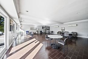 Panorama City apartment for rent - A modern dining room with a table set for six.