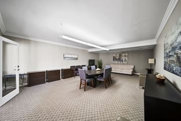 Panorama City apartment for rent - A living room with a grey carpet and a black piano.