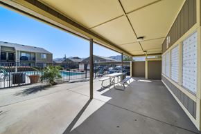 Banning apartment for rent - A sunny day at the poolside with a clear blue sky.
