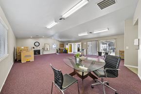 Banning apartment for rent - A conference room with a glass table and chairs.