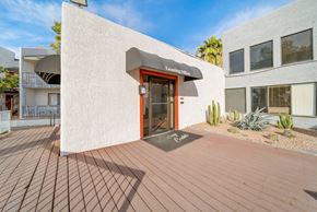 Phoenix apartment for rent - A building with a red door and a sign that says "Leasing Office".