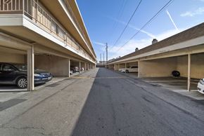 Hawthorne apartment for rent - A long, narrow street with cars parked on both sides.