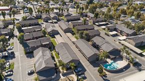 San Bernardino apartment for rent - A residential area with houses and a swimming pool.