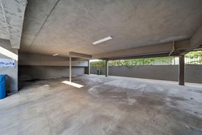 Hawthorne apartment for rent - A large, empty, concrete-floored room with a concrete ceiling and walls.