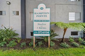 Hawthorne apartment for rent - A sign for Hampton Pointe Apartments is in front of a building.