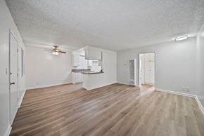 Hawthorne apartment for rent - A room with wooden flooring and white walls.