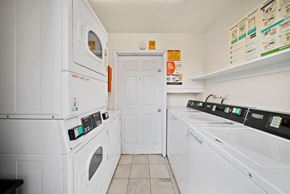 Palmdale apartment for rent - A white laundry room with a washer and dryer.