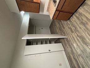 Newnan apartment for rent - A white cabinet with a drawer is open.