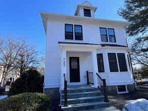 Wellesley apartment for rent - A white house with a black door and windows.