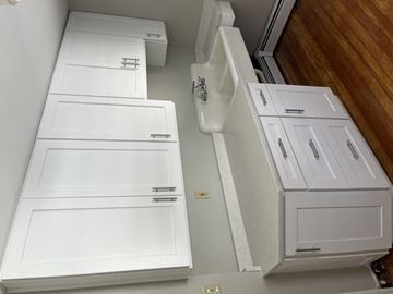 Andover apartment for rent - an overhead view of a kitchen with white cabinets and drawers