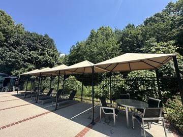 Andover apartment for rent - A patio with a table and chairs under a canopy.