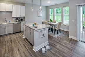 Freeport apartment for rent - A kitchen with a table and chairs in the middle of the room.