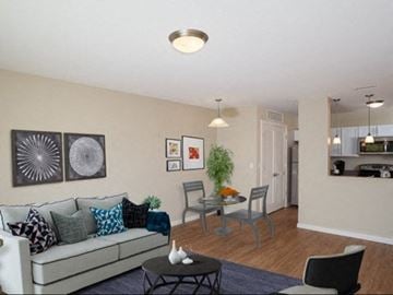 Beverly apartment for rent - a living room and dining room with a couch and a table