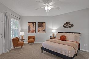 Cary apartment for rent - Bedroom with bed and ceiling fan  at Harrison Grande, Cary, NC, 27513