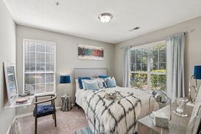 Canton apartment for rent - A bedroom with a large bed and a window with blinds at The Atlantic Canton Ridge, Georgia