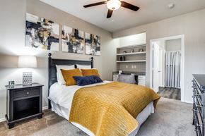 Westworth Village apartment for rent - a bedroom with a bed and a ceiling fan at Village of Hawks Creek Apartments, Westworth Village, 76114