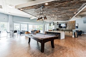 Cary apartment for rent - a game room with a pool table and a tv at Harrison Grande, Cary, NC
