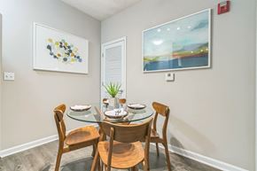 Atlanta apartment for rent - Dining room with a glass table and chairs at The Atlantic North Highland, Charlotte