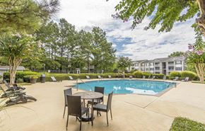 Canton apartment for rent - A pool area with chairs and a table.at The Atlantic Canton Ridge, Canton, 30114