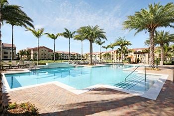 Expansive resort-inspired pool with cascading waterfall & heat spa