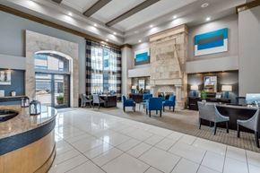 Houston apartment for rent - A spacious lobby with a reception desk and seating area. at Montecito Apartments, Houston