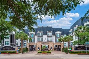 Houston apartment for rent - The image shows a large, luxurious building with a sign at Montecito Apartments, Texas