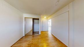 Berkeley apartment for rent - A long hallway with a door at the end.