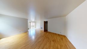Berkeley apartment for rent - A room with wooden floors and white walls.