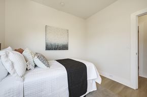Berkeley apartment for rent - A bedroom with a bed, pillows, and a painting on the wall.